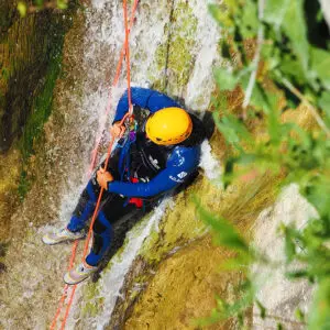 Slide rappeling at the beginning of the canyoning of the Gorges du Loup - Les Geckos