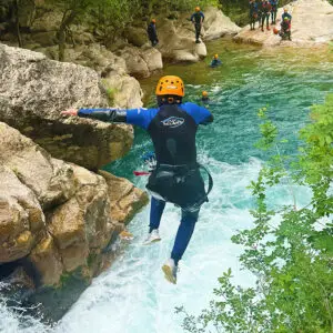 Jumping in the water in the Gorges du Loup canyon close to Vence, Grasse and Cannes on the french riviera - Les Geckos