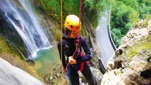 Impressive abseiling of the Courmes waterfall in the Gorges du Loup, French alps - Les Geckos