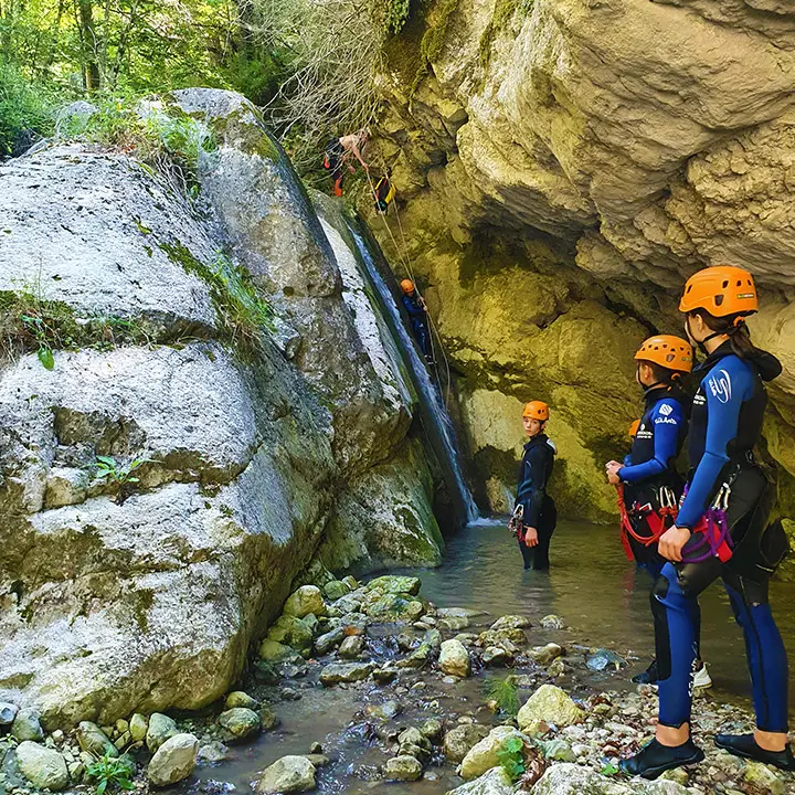 Abseiling down waterfall in canyoning Ganière, Gorges du Loup, french riviera - Les Geckos